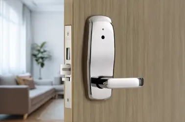 Electronic door lock hardware installed on a multi-family unit door